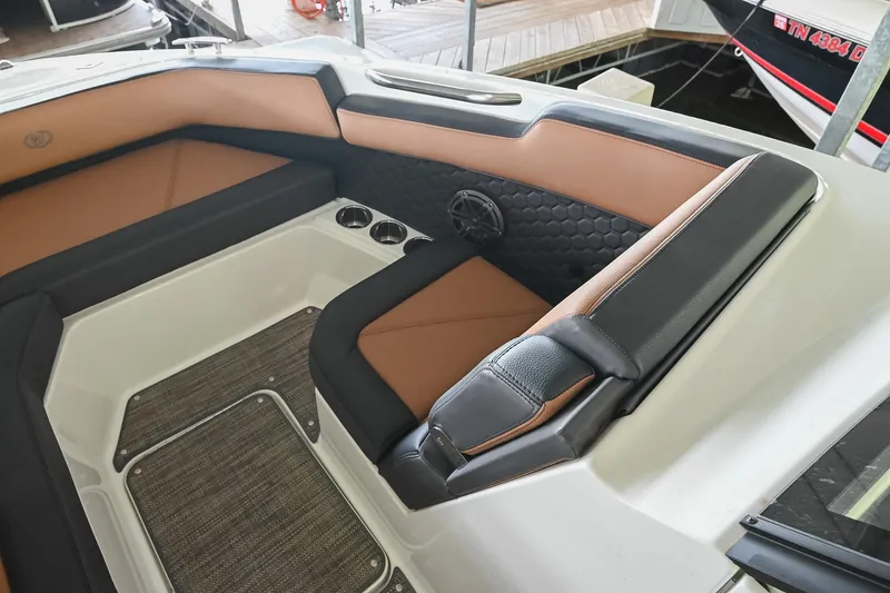 Slide: The Image of Interior seating of 2022 Cobalt R6 Surf boat with brown and black upholstery. - 41