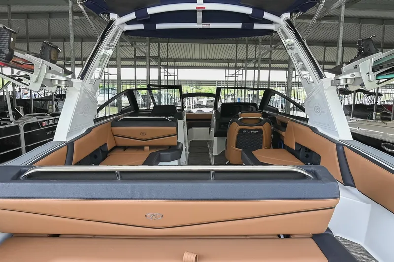 Slide: The Image of 2022 Cobalt R6 Surf boat interior with luxurious seating and modern design. - 7