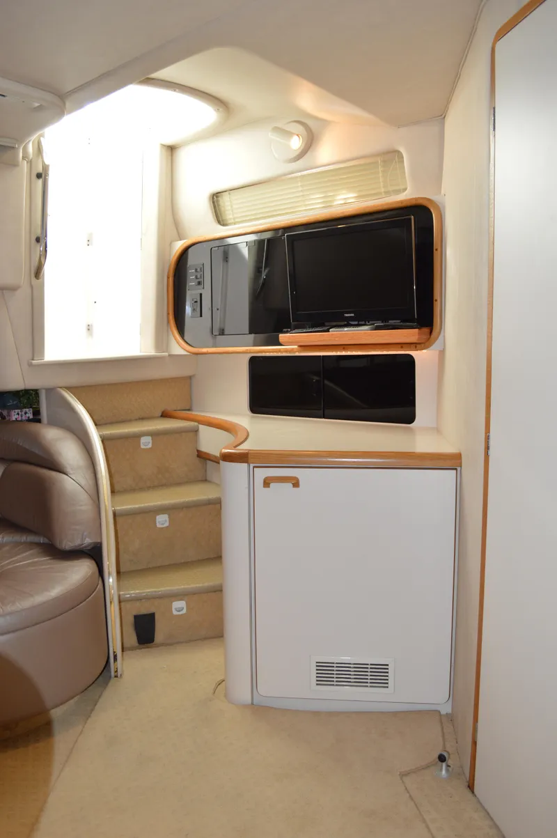 Slide: The Image of Interior of 1994 Sea Ray 500 Sundancer with stairs and cabinet. - 14