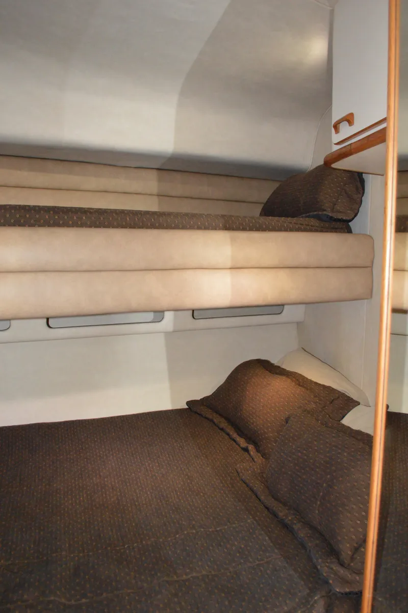 Slide: The Image of Interior of 1994 Sea Ray 500 Sundancer with bunk beds. - 23