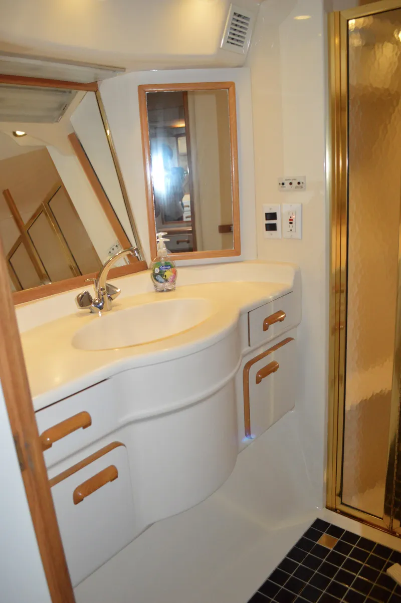 Slide: The Image of Luxurious bathroom of 1994 Sea Ray 500 Sundancer with shower. - 31