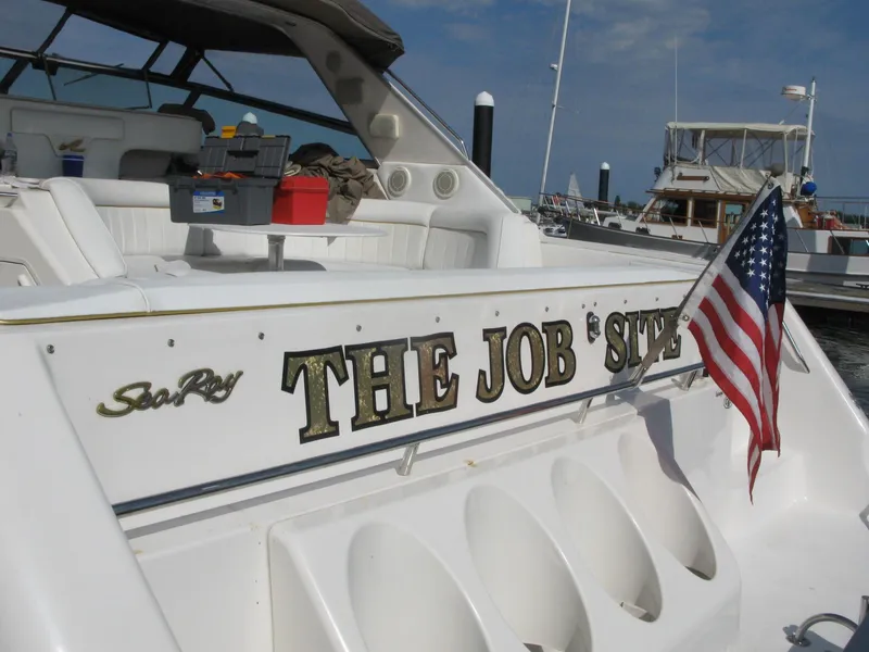 Slide: The Image of 1994 Sea Ray 500 Sundancer with US flag in harbor. - 5