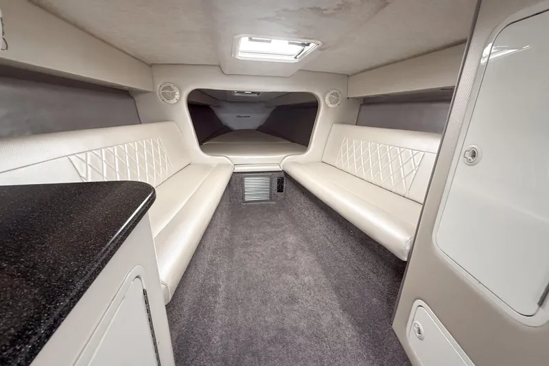 Slide: The Image of Interior of a 2002 Active Thunder 37 boat, featuring plush seating and modern design. - 15