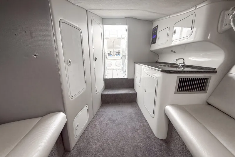 Slide: The Image of Interior of 2002 Active Thunder 37 boat with kitchenette and seating area. - 17