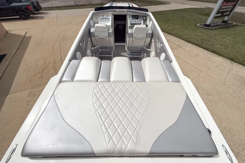 Slide: The Image of 2002 Active Thunder 37 boat interior with sleek white and gray seating design. - 20