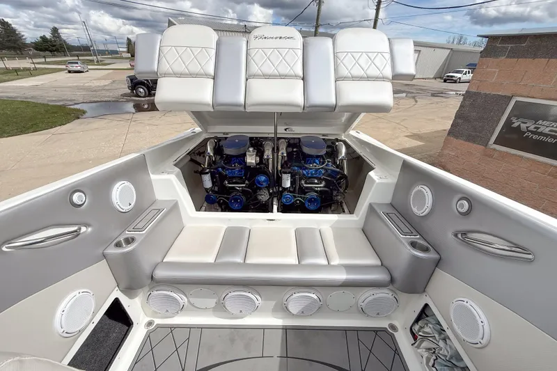 Slide: The Image of 2002 Active Thunder 37 boat engine compartment with seating and speakers. - 22