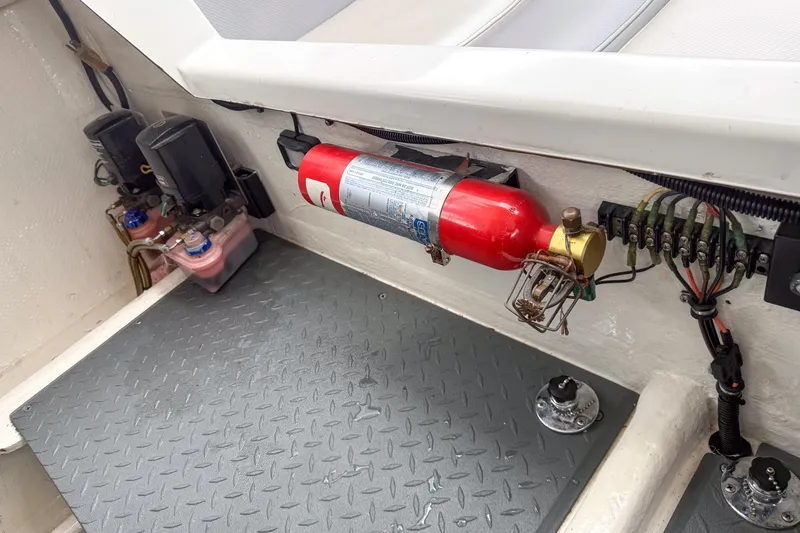 Slide: The Image of Interior of a 2002 Active Thunder 37 boat showing fire extinguisher and wiring. - 23