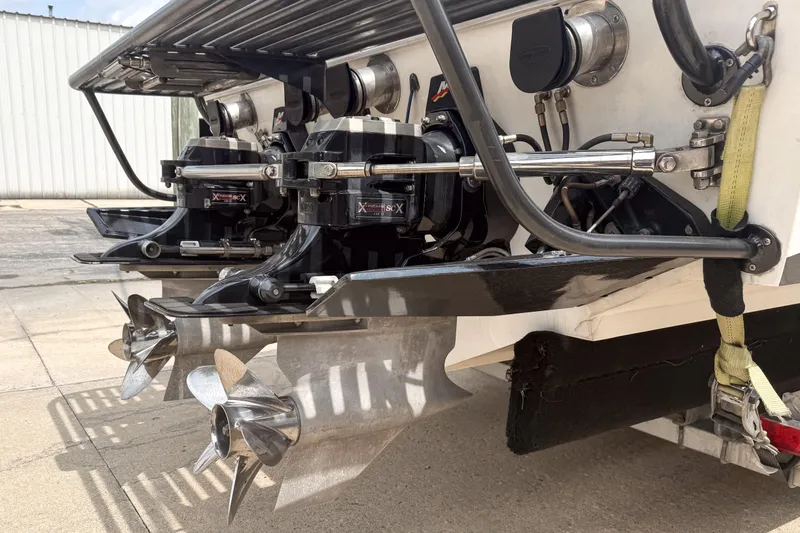 Slide: The Image of Rear view of a 2002 Active Thunder 37 boat with dual propellers and engine components. - 3