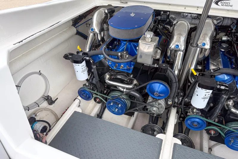 Slide: The Image of Engine compartment of a 2002 Active Thunder 37 boat, showcasing dual engines and components. - 30