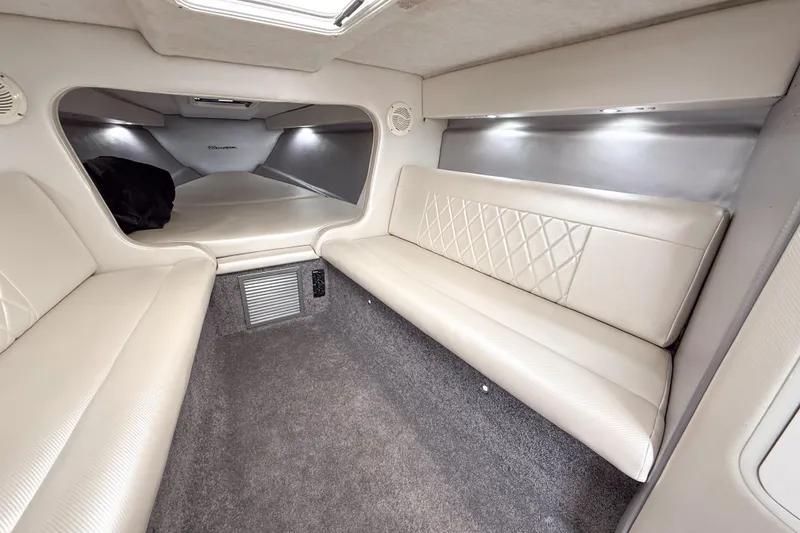 Slide: The Image of Luxurious interior of a 2002 Active Thunder 37 boat with plush seating and ambient lighting. - 34