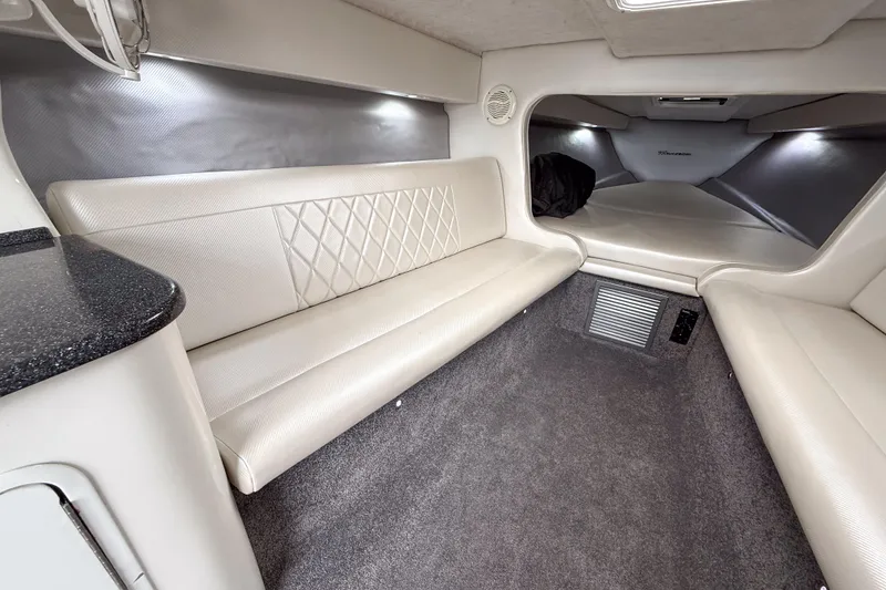 Slide: The Image of Interior of 2002 Active Thunder 37 boat, featuring plush seating and modern design. - 35