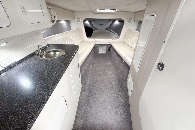 Slide: The Image of Interior of 2002 Active Thunder 37 boat with seating, sink, and modern amenities. - 38