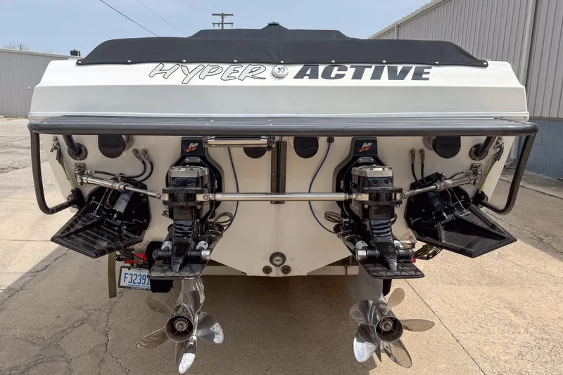 Slide: The Image of Rear view of a 2002 Active Thunder 37 boat with dual propellers. - 4