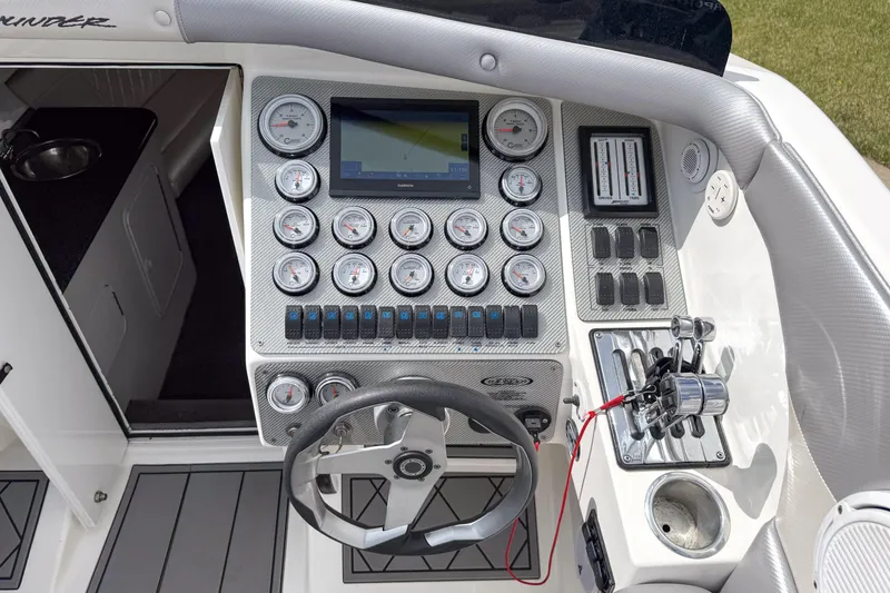 Slide: The Image of Cockpit of 2002 Active Thunder 37 boat with gauges, steering wheel, and controls. - 42
