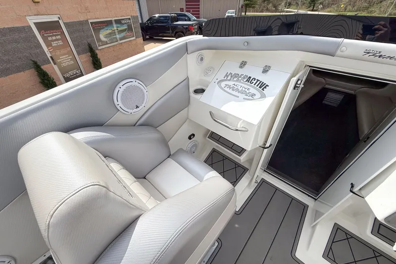 Slide: The Image of Interior view of a 2002 Active Thunder 37 boat, featuring sleek seating and modern design. - 43