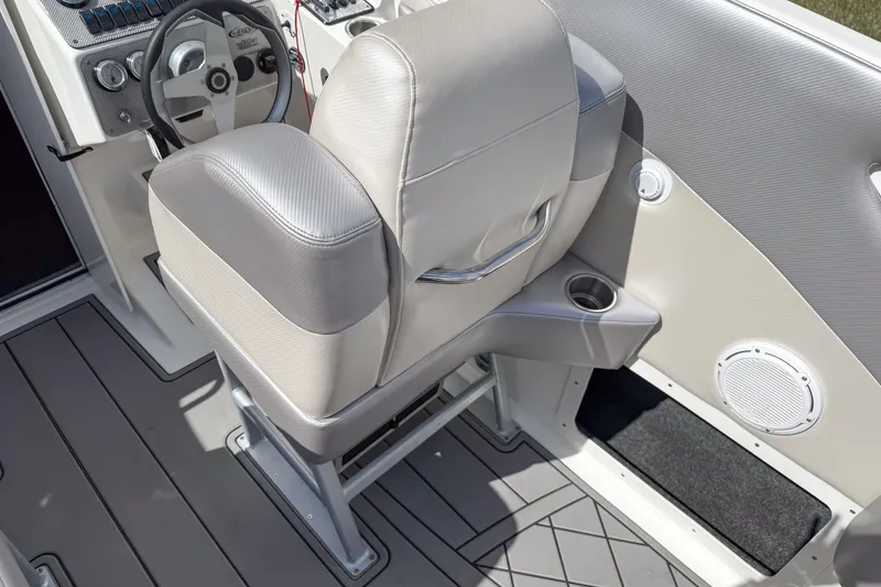 Slide: The Image of Interior of a 2002 Active Thunder 37 boat, featuring a steering wheel and cushioned seat. - 46