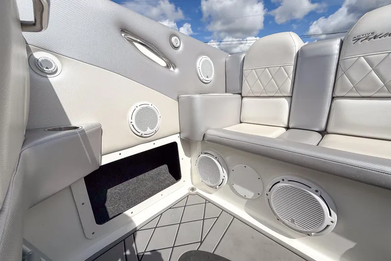 Slide: The Image of Luxurious interior of 2002 Active Thunder 37 boat with plush seating and built-in speakers. - 51