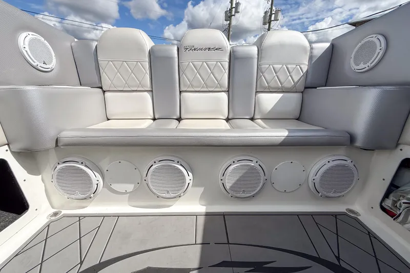 Slide: The Image of Luxury seating on a 2002 Active Thunder 37 boat with integrated speakers. - 52