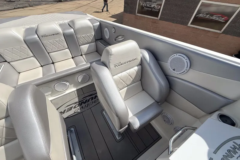 Slide: The Image of Interior of a 2002 Active Thunder 37 boat with luxurious seating and sleek design. - 54