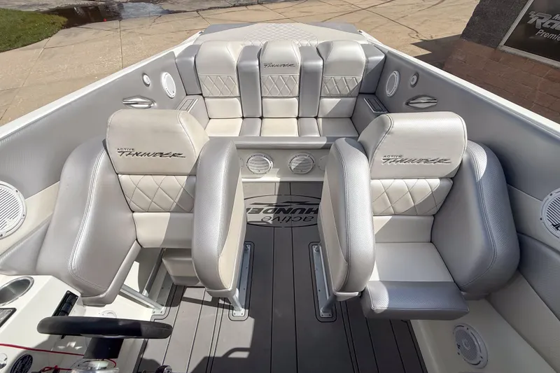 Slide: The Image of Interior of a 2002 Active Thunder 37 boat with luxurious seating and sleek design. - 56