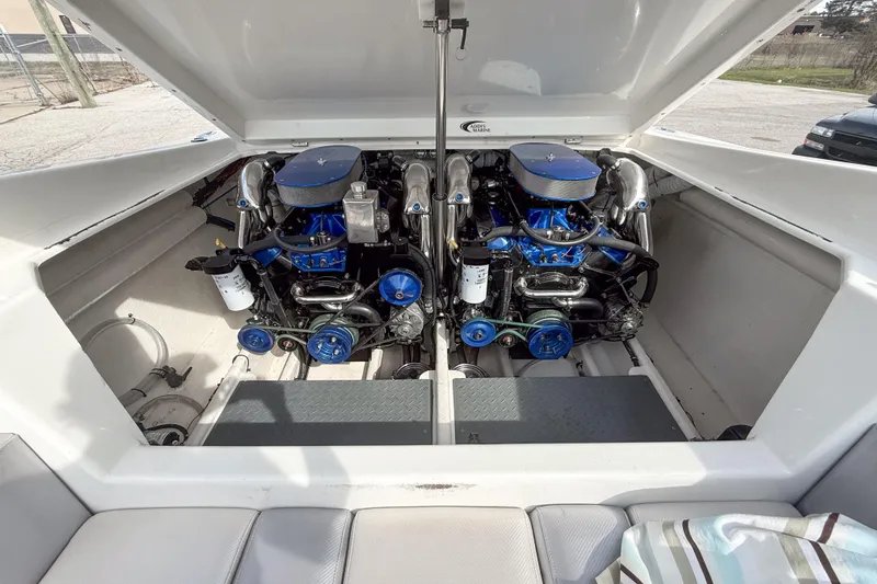 Slide: The Image of 2002 Active Thunder 37 boat engine compartment with dual high-performance engines. - 7
