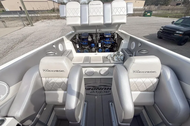 Slide: The Image of 2002 Active Thunder 37 boat interior with dual engines and luxurious seating. - 8
