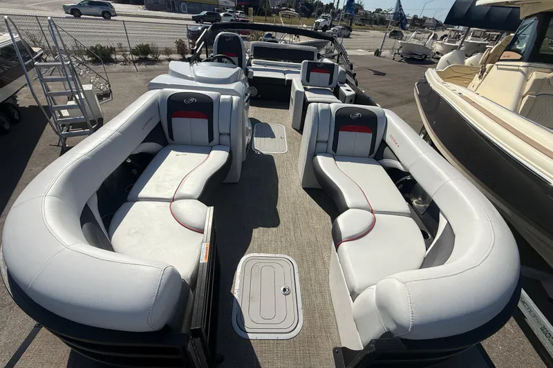 Slide: The Image of 2022 Barletta Corsa 23U pontoon boat with luxurious seating and modern design. - 15