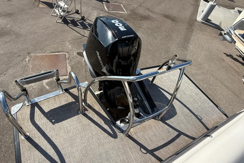 Slide: The Image of 2022 Barletta Corsa 23U boat with Mercury outboard motor and stainless steel railing. - 4