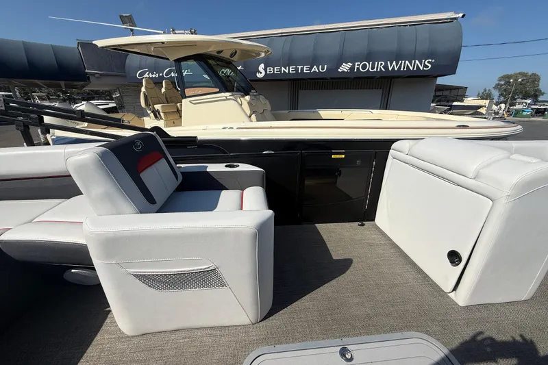 Slide: The Image of 2022 Barletta Corsa 23U pontoon boat interior with seating and storage compartments. - 9