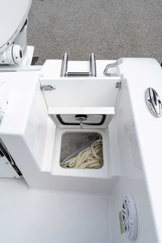 Slide: The Image of 2026 Sportsman Open 232 Center Console boat storage compartment. - 49