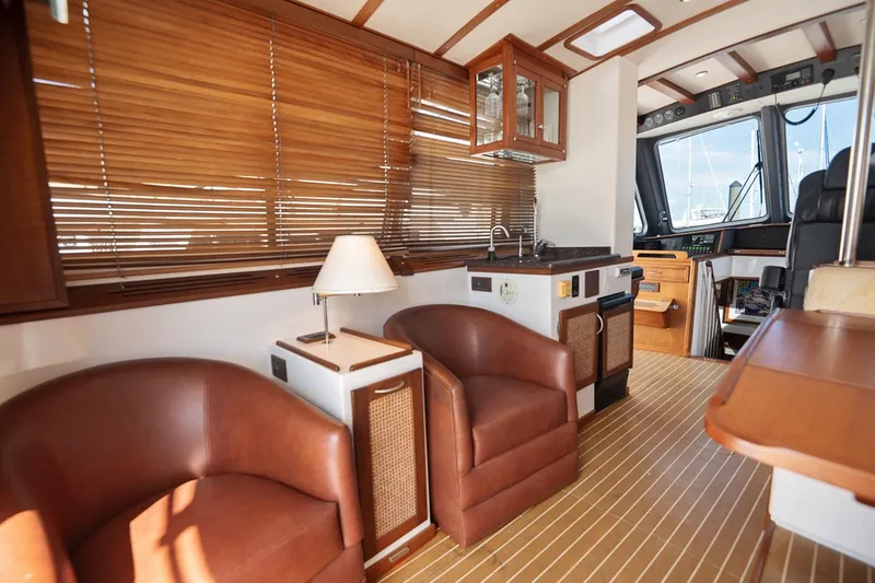 Slide: The Image of Luxurious 2007 Pilot Cruiser Expedition yacht interior with leather seating and wooden finishes. - 18