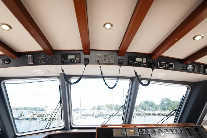 Slide: The Image of 2007 Pilot Cruiser Expedition boat cockpit with navigation equipment and marina view. - 21