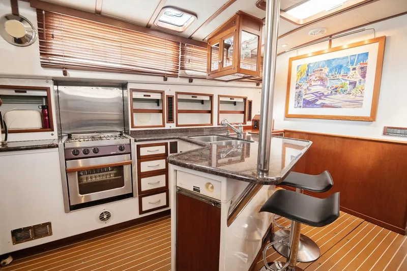 Slide: The Image of Luxurious 2007 Pilot Cruiser Expedition yacht kitchen with modern appliances and stylish decor. - 37
