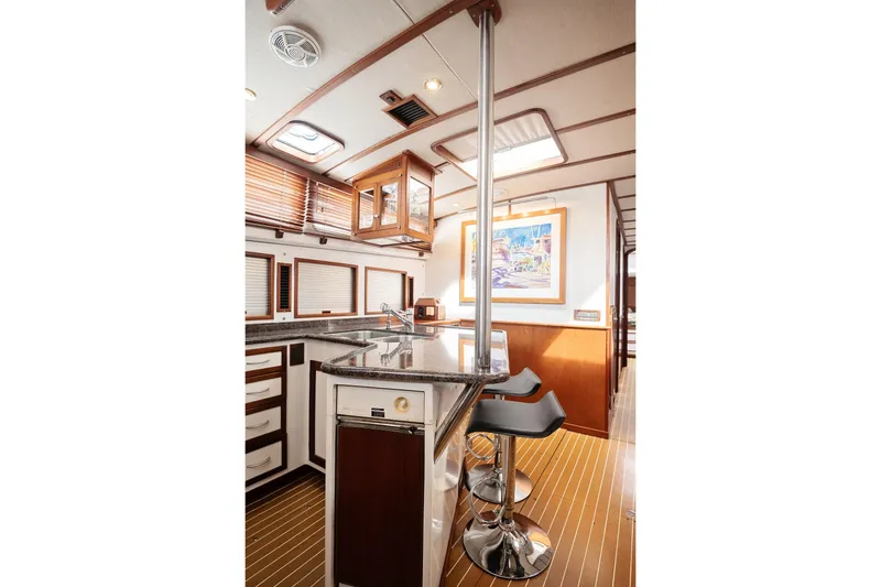 Slide: The Image of Luxurious 2007 Pilot Cruiser Expedition yacht interior with modern kitchen and bar stools. - 56