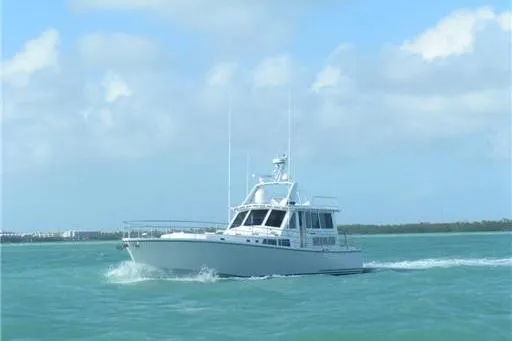 Slide: The Image of 2007 Pilot Cruiser Expedition boat navigating calm blue waters under a clear sky. - 6
