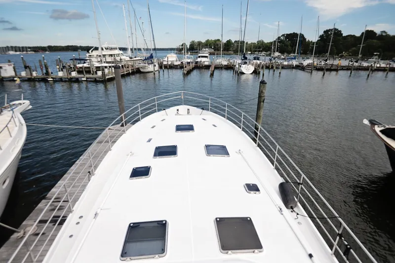 Slide: The Image of 2007 Pilot Cruiser Expedition yacht docked at a marina with scenic water views. - 70