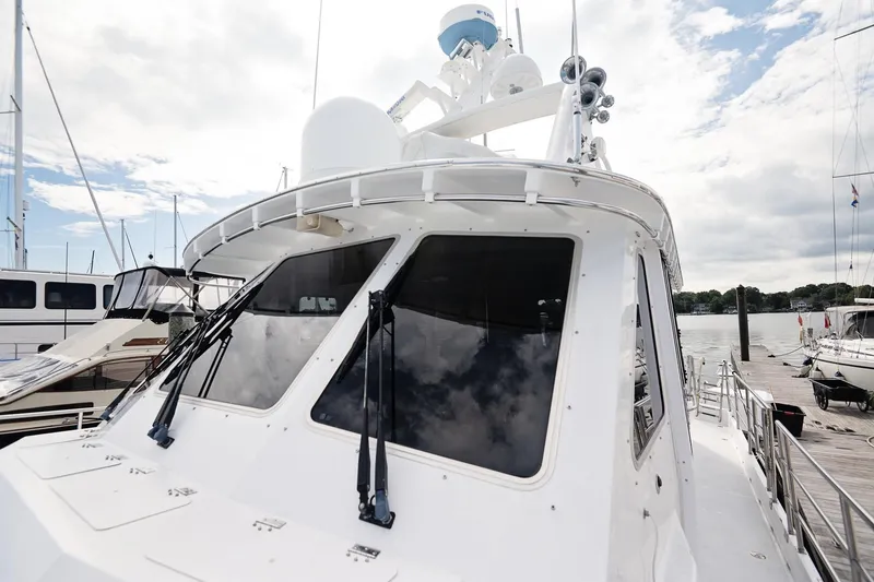 Slide: The Image of 2007 Pilot Cruiser Expedition yacht docked at marina under partly cloudy sky. - 75