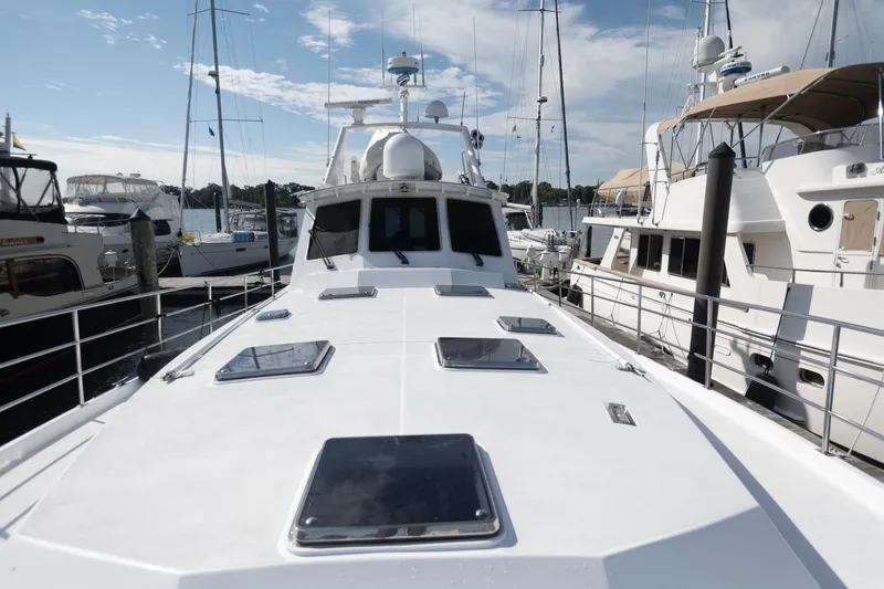 Slide: The Image of 2007 Pilot Cruiser Expedition yacht docked at marina under clear sky. - 9