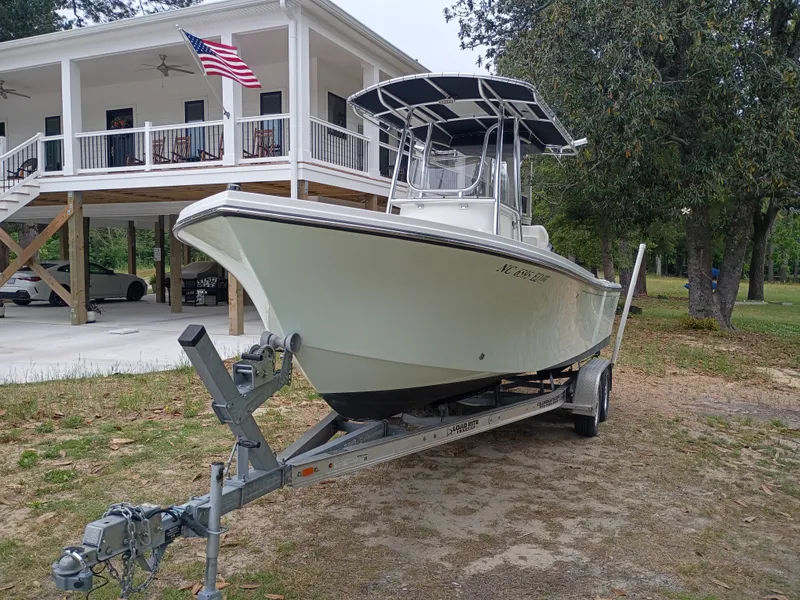 The Image of 2016 Parker 23SE boat on trailer in front of a house. - 0