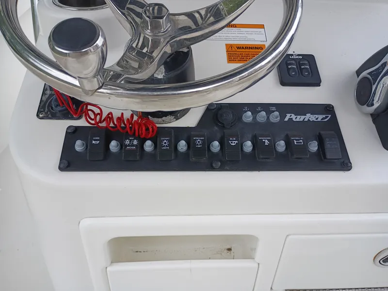 Slide: The Image of Control console of a 2016 Parker 23SE boat. - 12
