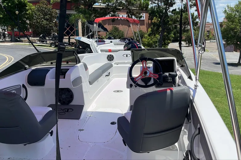 Slide: The Image of The image shows the cockpit of a 2026 Tahoe T21 boat with gray seats and a modern helm. - 5