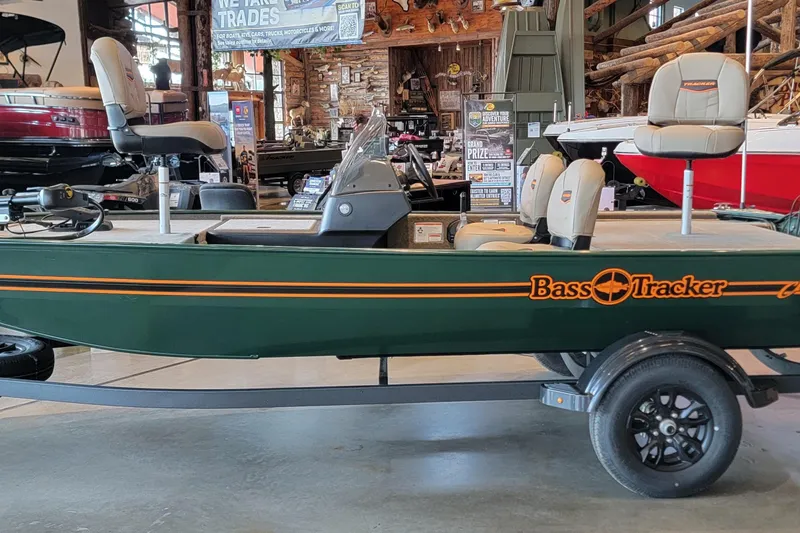 The Image of 2026 Tracker Bass Tracker Classic Limited boat displayed indoors on a trailer. - 0