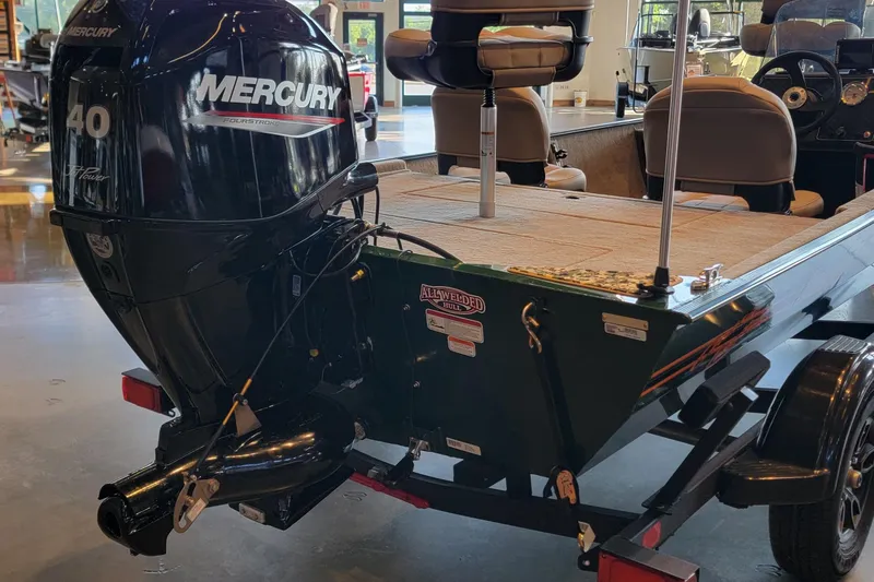 Slide: The Image of 2026 Tracker Bass Tracker Classic Limited boat with Mercury 40HP engine in showroom. - 2