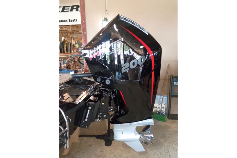 Slide: The Image of 2026 Ranger Z518 Cup-Equipped boat engine, black with red accents, displayed indoors. - 4