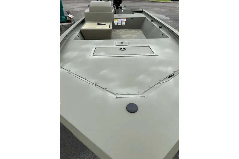 Slide: The Image of 2025 Tracker Grizzly 1648 SC boat, showcasing spacious deck and storage compartments. - 3