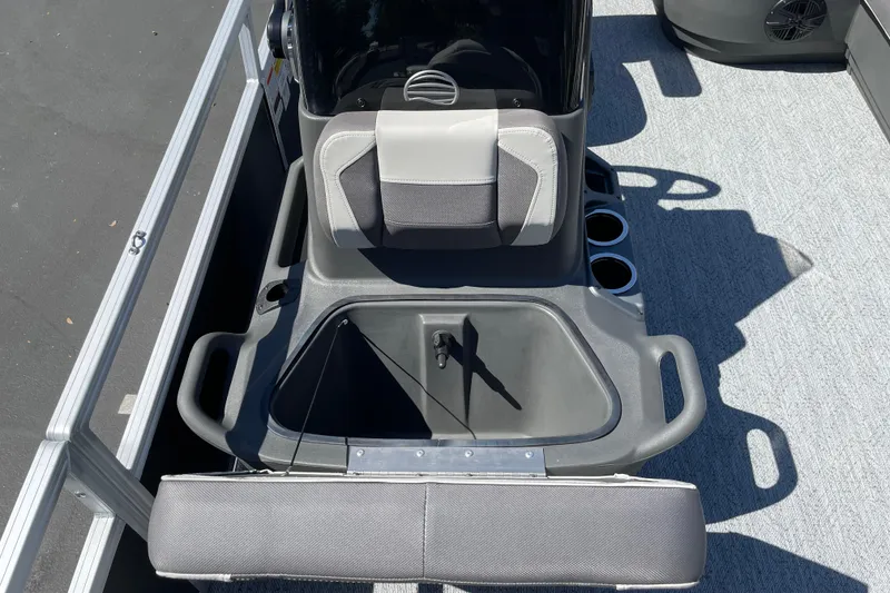 Slide: The Image of 2026 Sun Tracker Bass Buggy 18 DLX boat interior with seating and storage. - 17