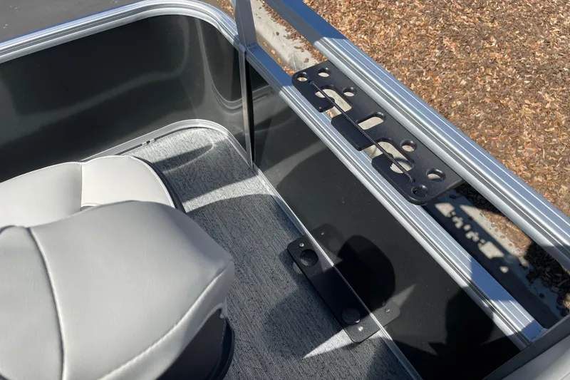 Slide: The Image of Interior view of 2026 Sun Tracker Bass Buggy 18 DLX pontoon boat with seating and railing. - 29