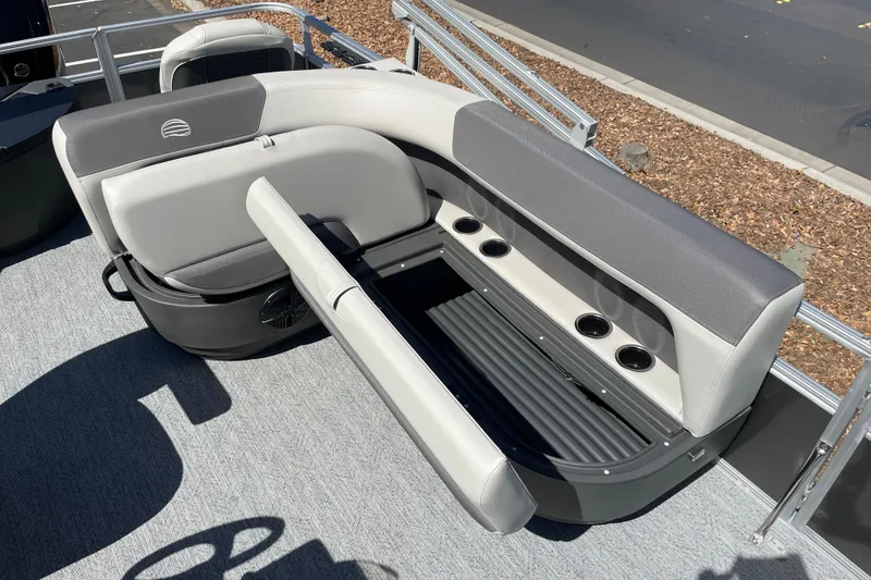 Slide: The Image of 2026 Sun Tracker Bass Buggy 18 DLX pontoon boat seating with storage and cup holders. - 19