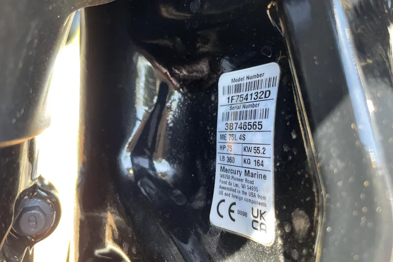 Slide: The Image of Label on Mercury Marine engine, showing model and serial numbers, horsepower, and weight details. - 117