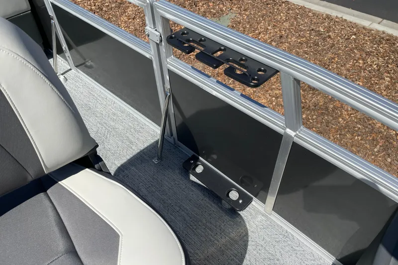 Slide: The Image of 2026 Sun Tracker Bass Buggy 18 DLX interior with seating and railing details. - 13